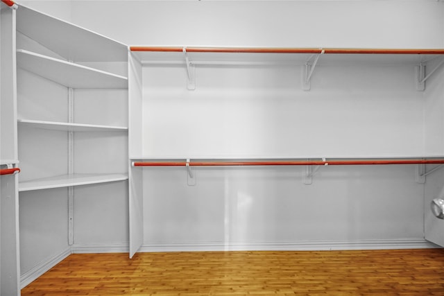 9406 Laurel Wind Ct, Houston, TX 77040 - spacious closet with wood finished floors