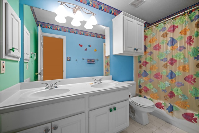 9406 Laurel Wind Ct, Houston, TX 77040 - bathroom with double vanity, tile patterned flooring, and shower / bath combination with curtain