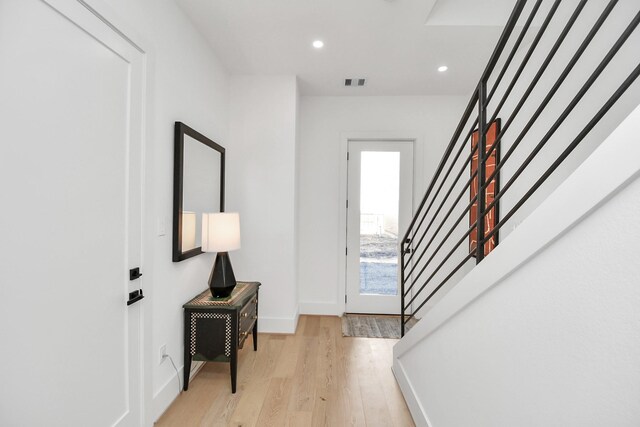 entrance foyer featuring recessed lighting, visible vents, baseboards, stairs, and light wood-type flooring