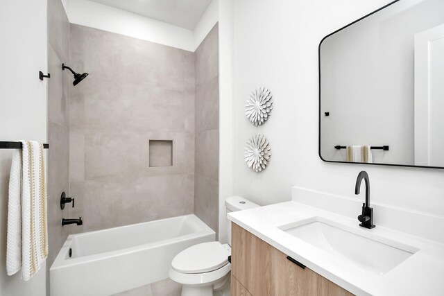 bathroom featuring toilet, shower / washtub combination, and vanity