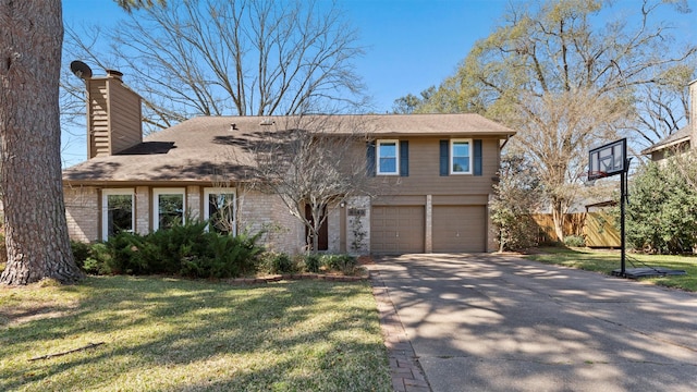 view of front facade with driveway, a front lawn, a chimney, and an attached garage