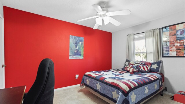 bedroom with carpet floors, ceiling fan, and baseboards