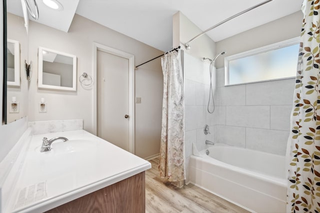 full bath with shower / bath combo with shower curtain, wood finished floors, and vanity