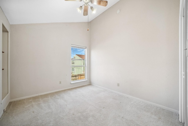 unfurnished bedroom with a ceiling fan, lofted ceiling, carpet flooring, and baseboards