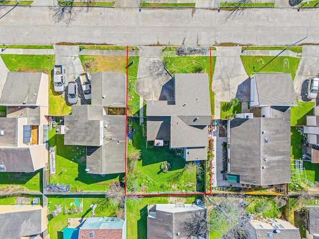 birds eye view of property with a residential view