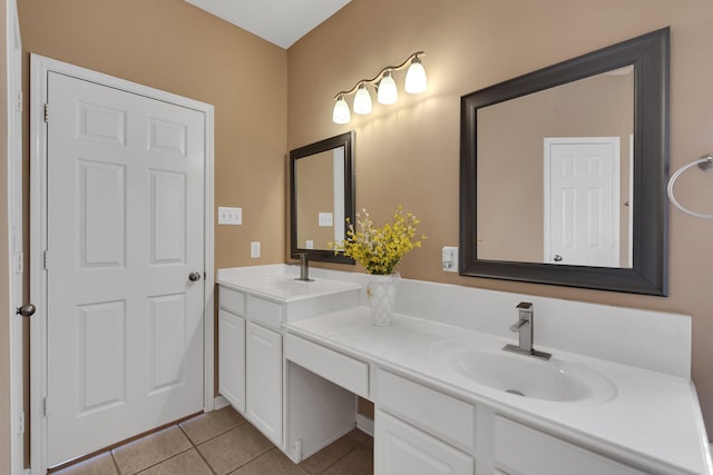 bathroom with double vanity, tile patterned flooring, and a sink