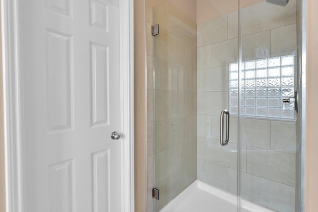 bathroom featuring a shower stall