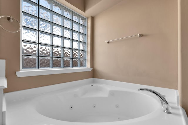 full bath featuring a tub with jets