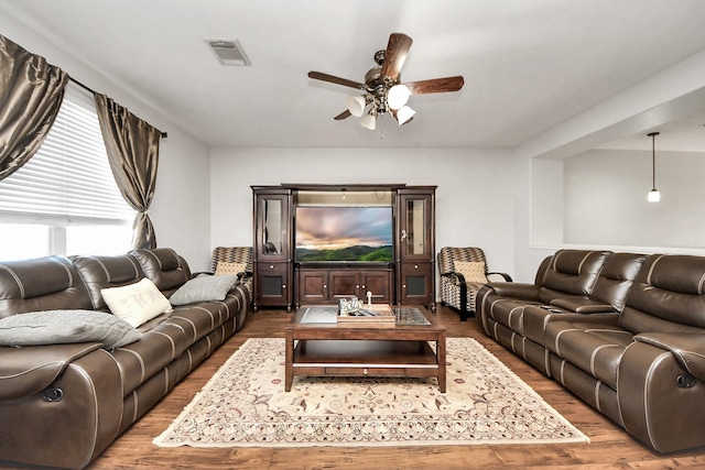 10138 W Palm Lake Dr, Houston, TX 77034 - living room featuring a ceiling fan, visible vents, and wood finished floors