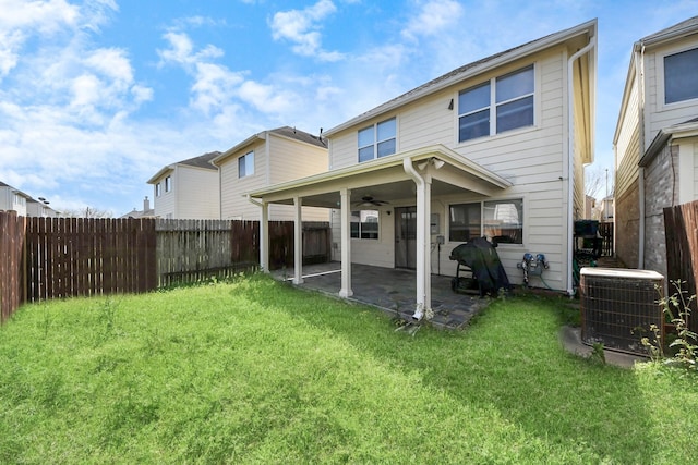 10138 W Palm Lake Dr, Houston, TX 77034 - back of property featuring ceiling fan, a fenced backyard, central AC, a lawn, and a patio area