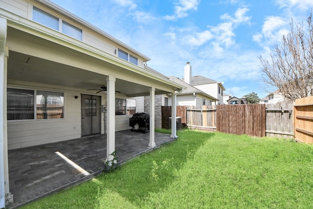 10138 W Palm Lake Dr, Houston, TX 77034 - view of yard featuring a ceiling fan, cooling unit, a patio, and fence