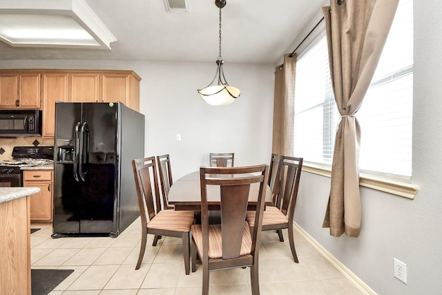 10138 W Palm Lake Dr, Houston, TX 77034 - dining room with baseboards, visible vents, and light tile patterned flooring