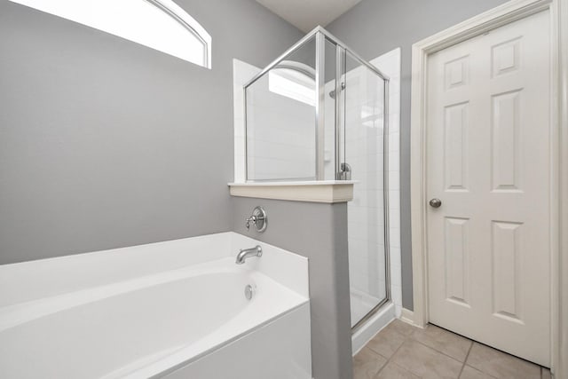 10138 W Palm Lake Dr, Houston, TX 77034 - bathroom featuring a garden tub, a shower stall, and tile patterned floors