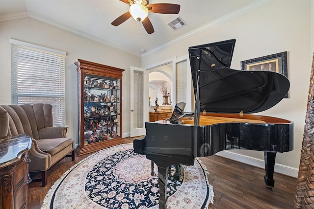 sitting room with visible vents, baseboards, lofted ceiling, ornamental molding, and wood finished floors