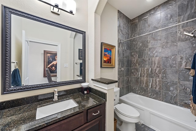 bathroom featuring toilet, vanity, and bathing tub / shower combination