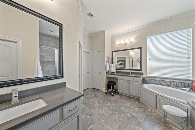 full bath with ornamental molding, tiled shower, visible vents, and a sink