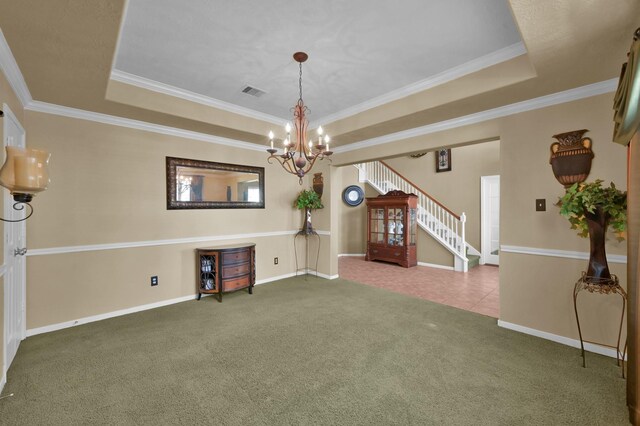 interior space featuring a tray ceiling, stairway, carpet flooring, and ornamental molding