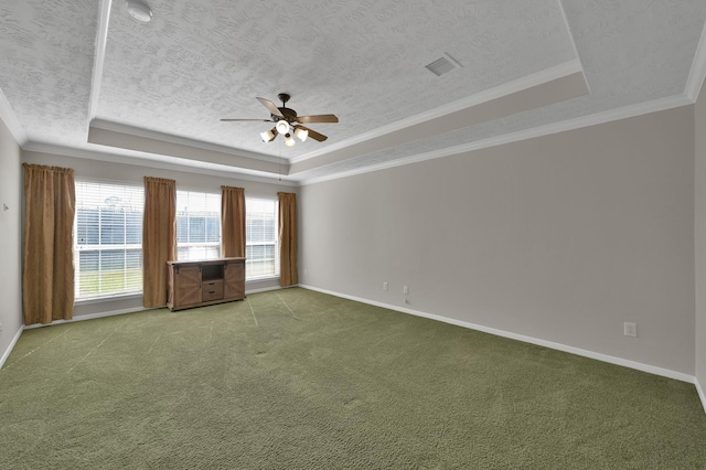 spare room featuring visible vents, a raised ceiling, a textured ceiling, and carpet flooring