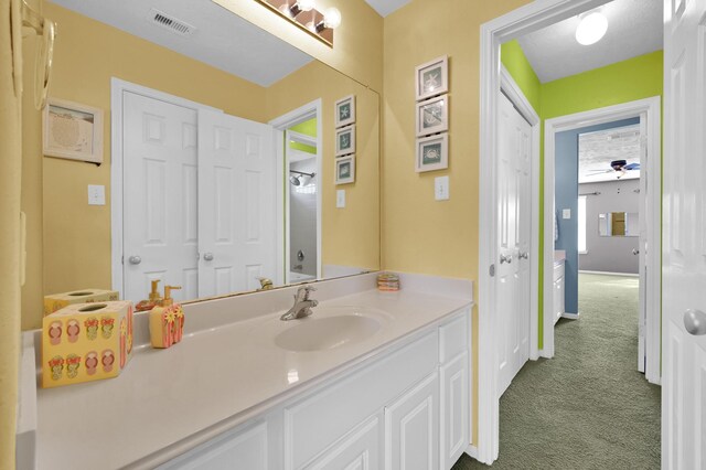 bathroom featuring visible vents and vanity