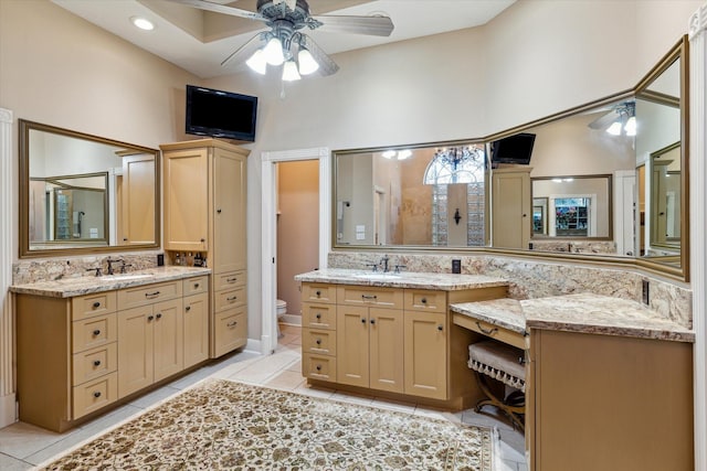 bathroom featuring tile patterned floors, a stall shower, and a sink