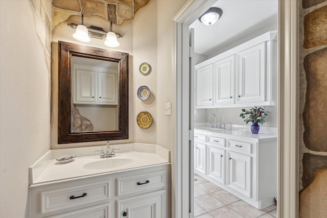 bathroom featuring tile patterned flooring and vanity