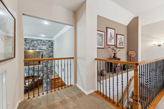 hall featuring an upstairs landing, recessed lighting, carpet, crown molding, and baseboards