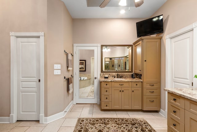 full bathroom featuring tile patterned flooring, vanity, baseboards, and ceiling fan