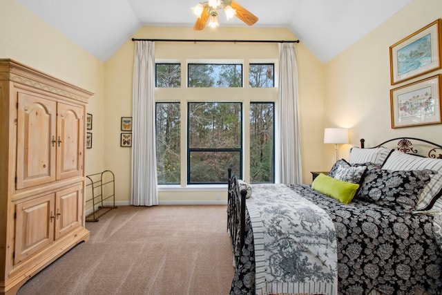 carpeted bedroom with ceiling fan, baseboards, and lofted ceiling