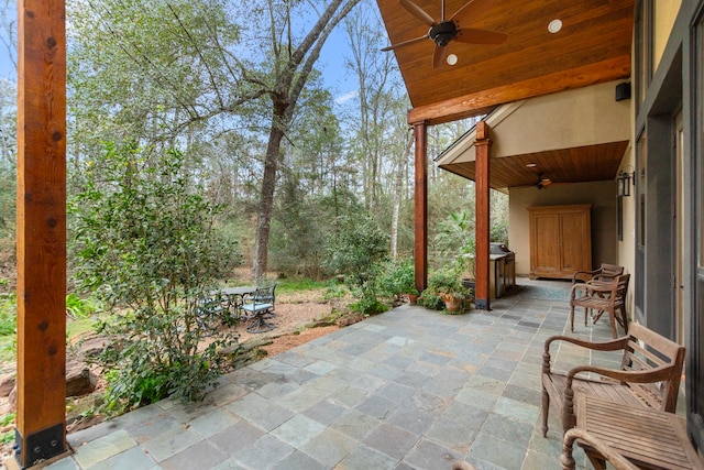 view of patio featuring ceiling fan