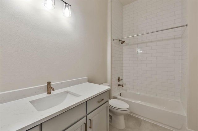 full bathroom with tub / shower combination, vanity, toilet, and tile patterned floors