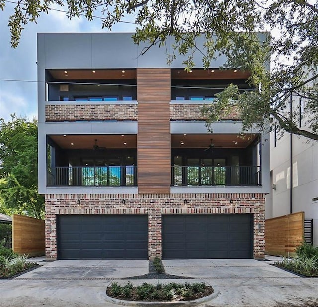 view of front facade featuring a garage, brick siding, and driveway