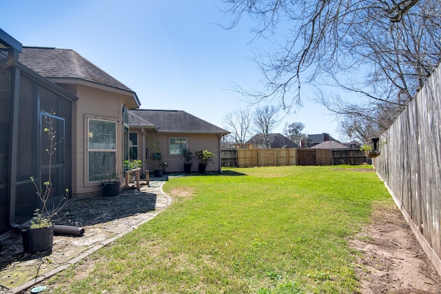 view of yard with a fenced backyard