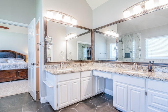 bathroom with a sink, plenty of natural light, and a stall shower