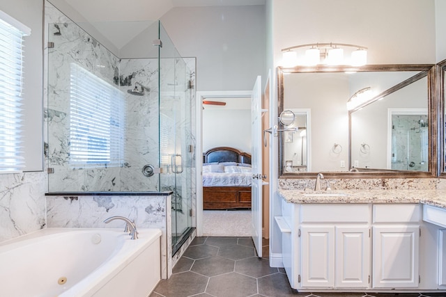 full bath featuring a marble finish shower, connected bathroom, a bath, vanity, and vaulted ceiling