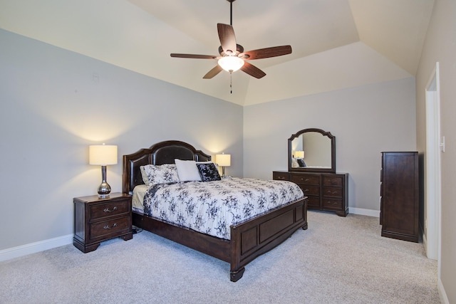 bedroom featuring light carpet, a ceiling fan, and baseboards