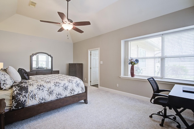 bedroom featuring visible vents, lofted ceiling, a ceiling fan, carpet floors, and baseboards