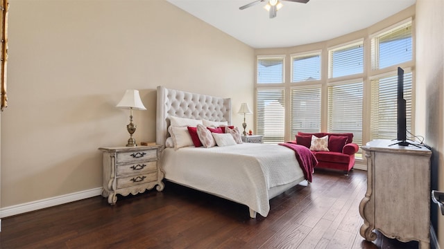 bedroom featuring lofted ceiling, baseboards, dark wood-style flooring, and ceiling fan