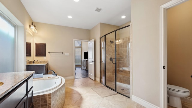 bathroom with visible vents, two vanities, a stall shower, a bath, and a sink