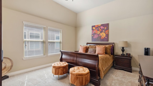 bedroom with baseboards and light carpet