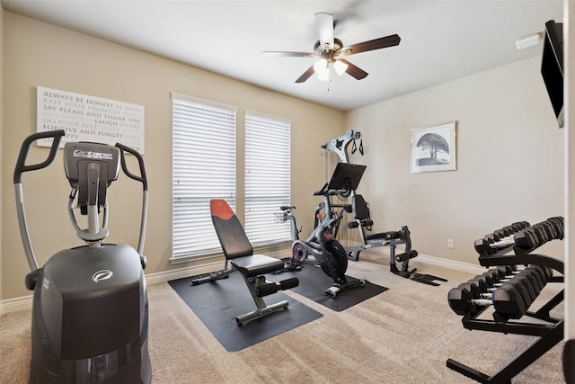 workout room featuring baseboards, carpet, and a ceiling fan