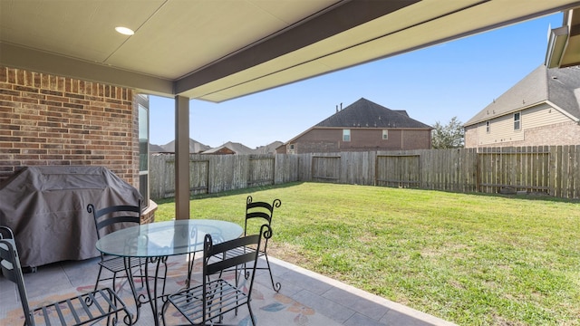 view of patio featuring outdoor dining area and a fenced backyard