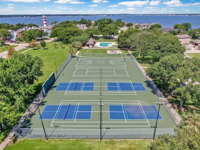 birds eye view of property with a water view