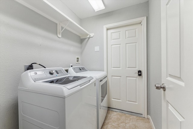 laundry area with laundry area and separate washer and dryer