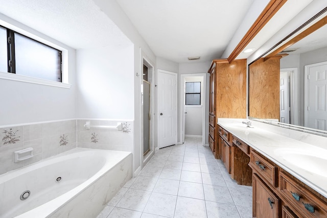 full bath with double vanity, visible vents, a stall shower, tile patterned flooring, and a tub with jets