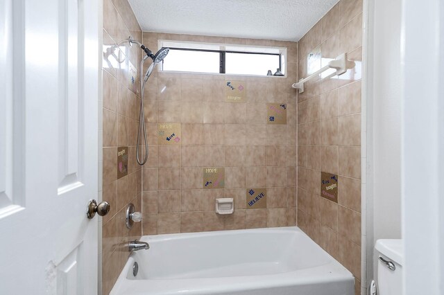 full bath featuring toilet, a textured ceiling, and bathing tub / shower combination