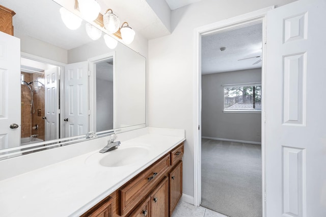 full bathroom featuring a textured ceiling, shower / tub combination, vanity, tile patterned flooring, and baseboards