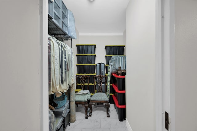 spacious closet with marble finish floor