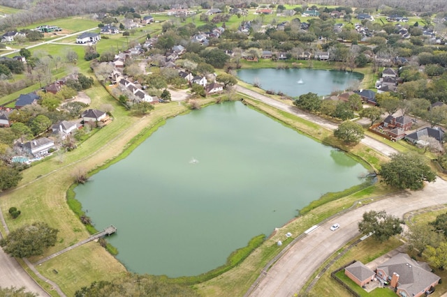 aerial view with a water view and a residential view