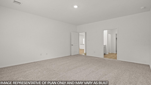 1507 Portia Ct, Conroe, TX 77301 - spare room featuring light carpet, a smoke detector, recessed lighting, and baseboards