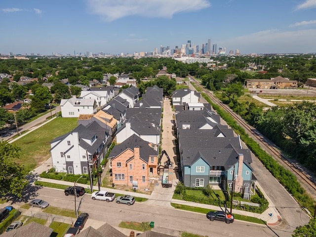 birds eye view of property featuring a city view